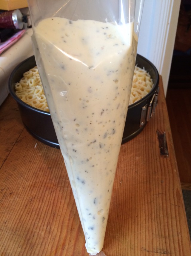 Ricotta cheese mixture ready to pipe into rigatoni